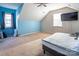 Large bedroom with blue walls and a view from the window at 18023 Train Station Dr, Cornelius, NC 28031