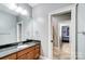 Simple bathroom with granite countertop and a view of another bedroom at 20361 Enclave Oaks Ct, Cornelius, NC 28031