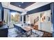 Elegant dining room features a live-edge table and a dramatic blue accent wall at 20361 Enclave Oaks Ct, Cornelius, NC 28031