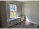 Bright bedroom with built-in window seat and storage at 223 Chester Ave, Great Falls, SC 29055