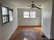 Living room with hardwood floors and brick wall at 223 Chester Ave, Great Falls, SC 29055