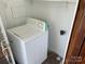 Laundry area with a washer and overhead shelving at 223 Chester Ave, Great Falls, SC 29055