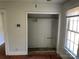Small bedroom closet with wood shelving at 223 Chester Ave, Great Falls, SC 29055