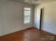 Simple bedroom with hardwood floors and a window at 223 Chester Ave, Great Falls, SC 29055