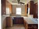 Kitchen with wood cabinets, double sink, and window at 223 Chester Ave, Great Falls, SC 29055