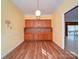 Bright kitchen features ample wood cabinetry and a light wood laminate floor at 910 Basilwild Dr, Wadesboro, NC 28170