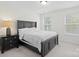 Main bedroom with a dark wood frame bed and ensuite access at 122 W Heart Pine Ln, Statesville, NC 28677