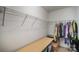 Large walk-in closet with built-in shelves and hanging rods at 12413 Stowe Acres Dr, Charlotte, NC 28262