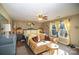 Main bedroom with a king-size bed, sitting area, and large windows at 12413 Stowe Acres Dr, Charlotte, NC 28262