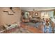 Cozy living room featuring hardwood floors and plenty of natural light at 12413 Stowe Acres Dr, Charlotte, NC 28262