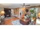 Living room with fireplace, hardwood floors, and ample natural light at 12413 Stowe Acres Dr, Charlotte, NC 28262