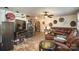 Living room with sectional sofa, hardwood floors, and a fireplace at 12413 Stowe Acres Dr, Charlotte, NC 28262