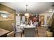Dining room with hardwood floors, and view into kitchen at 12413 Stowe Acres Dr, Charlotte, NC 28262