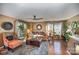 Bright living room with hardwood floors, comfy seating, and a ceiling fan at 12413 Stowe Acres Dr, Charlotte, NC 28262
