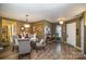 Dining room with hardwood floors, and view into kitchen at 12413 Stowe Acres Dr, Charlotte, NC 28262