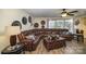 Spacious living room featuring a large sectional sofa and hardwood floors at 12413 Stowe Acres Dr, Charlotte, NC 28262
