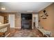 Living room with a fireplace, built-in shelving, and a flat-screen TV at 12413 Stowe Acres Dr, Charlotte, NC 28262