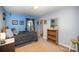 Charming bedroom with a full-size bed and built-in shelving at 12413 Stowe Acres Dr, Charlotte, NC 28262