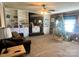 Living room with fireplace, built-in shelving, and wood accent wall at 1407 Mcilwain Rd, Lancaster, SC 29720