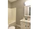 Simple bathroom with white vanity, tub, and mirror at 143 White Farm Rd, Dallas, NC 28034