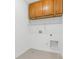 Bright laundry room with upper cabinets and shelving at 151 Heywatchis Dr, Mooresville, NC 28115