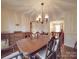 Dining room features a wood table and buffet at 5001 Belford Ct, Charlotte, NC 28226