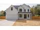 Stunning two-story white house with black accents and a large yard at 9000 Boyd Dr, Matthews, NC 28105