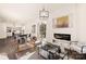 Open living room with kitchen views, fireplace, and natural light at 9000 Boyd Dr, Matthews, NC 28105