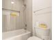 Modern bathroom with a shower/tub combo, tiled walls, and built-in shelving at 9000 Boyd Dr, Matthews, NC 28105