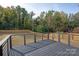 Deck overlooking backyard with modern railing and privacy fence at 9000 Boyd Dr, Matthews, NC 28105