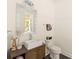 Modern powder room with a floating vanity and decorative mirror at 9000 Boyd Dr, Matthews, NC 28105