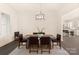 Bright dining room features a spacious table with six chairs and an open view to the kitchen at 9000 Boyd Dr, Matthews, NC 28105