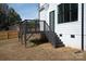Modern deck with black railings and stairs at 9000 Boyd Dr, Matthews, NC 28105