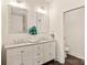 Double vanity bathroom with granite countertop, large mirrors, and separate toilet area at 9000 Boyd Dr, Matthews, NC 28105