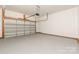 Attached garage with automatic opener and epoxy coated floor at 9000 Boyd Dr, Matthews, NC 28105