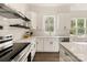 White kitchen with stainless steel appliances and white subway tile backsplash at 9000 Boyd Dr, Matthews, NC 28105