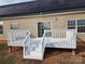 White deck with stairs, and solar panels on house at 129 Burning Ln, Stony Point, NC 28678