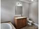Bathroom features a vanity with sink and a toilet at 129 Burning Ln, Stony Point, NC 28678