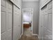 Hallway with double closets and bathroom access at 129 Burning Ln, Stony Point, NC 28678
