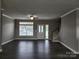 Spacious living room with hardwood floors and lots of natural light at 129 Burning Ln, Stony Point, NC 28678