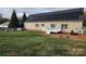 House back with solar panels, deck, and firepit at 129 Burning Ln, Stony Point, NC 28678