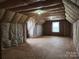Unfinished bonus room with window and potential for expansion at 129 Burning Ln, Stony Point, NC 28678