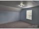 Spacious bonus room with light blue walls and carpeted floor at 129 Burning Ln, Stony Point, NC 28678
