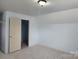 Bonus room with light blue walls and closet at 129 Burning Ln, Stony Point, NC 28678