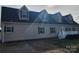 Two-story house with a gray roof, dormer windows, and a white porch at 129 Burning Ln, Stony Point, NC 28678