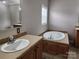 Bathroom with double sinks, garden tub, and separate shower at 129 Burning Ln, Stony Point, NC 28678
