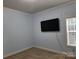 Bright bedroom with light blue walls and carpeted floor at 129 Burning Ln, Stony Point, NC 28678