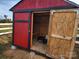Red and black chicken coop with open door at 129 Burning Ln, Stony Point, NC 28678