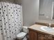 Bathroom with shower, toilet, and polka dot shower curtain at 129 Burning Ln, Stony Point, NC 28678