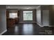 Dining area with dark laminate flooring and kitchen view at 129 Burning Ln, Stony Point, NC 28678